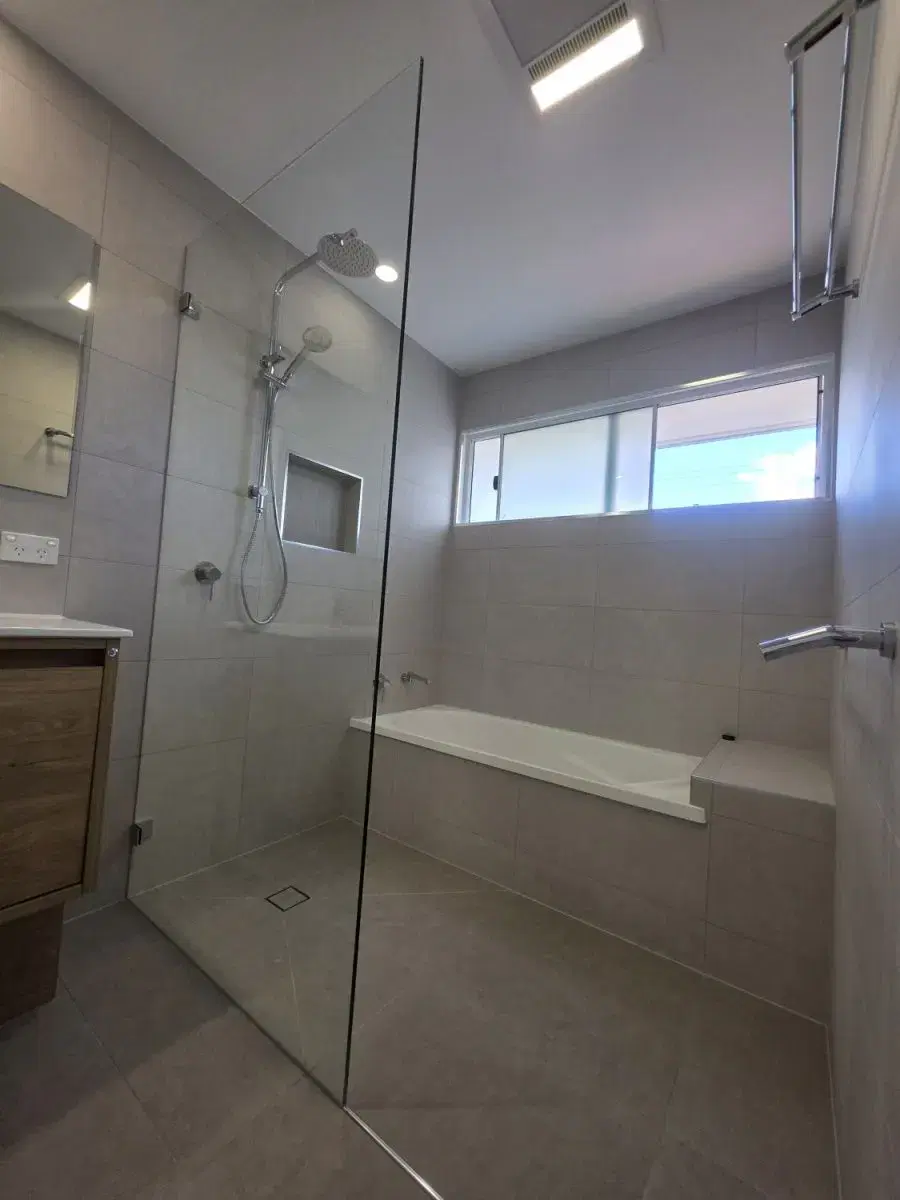 Completed Brookfield bathroom with open shower and built-in bath