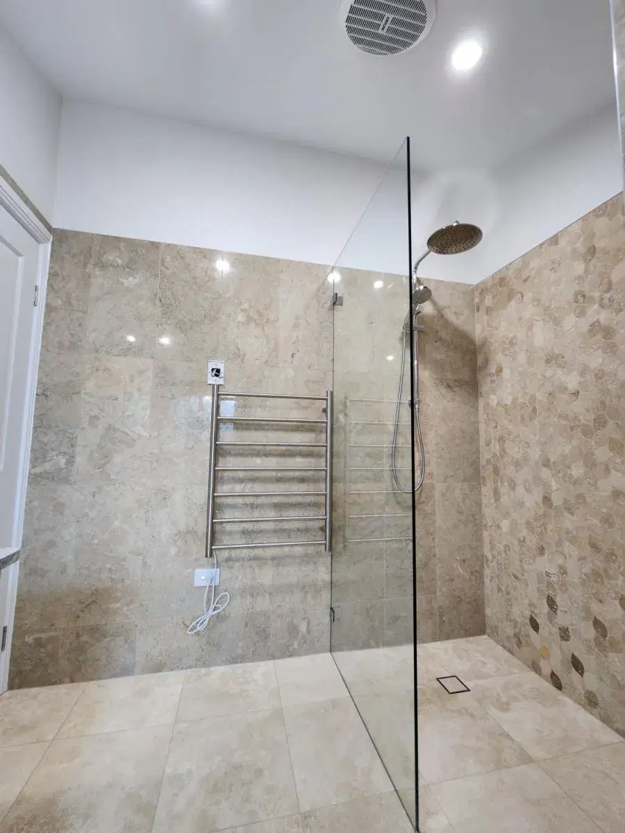 Completed North Ipswich walk-in shower with feature stone tiling
