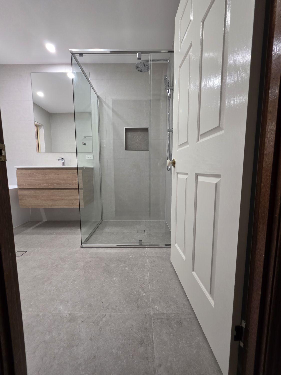 Bellbowrie bathroom after renovation with a larger clear-glass shower