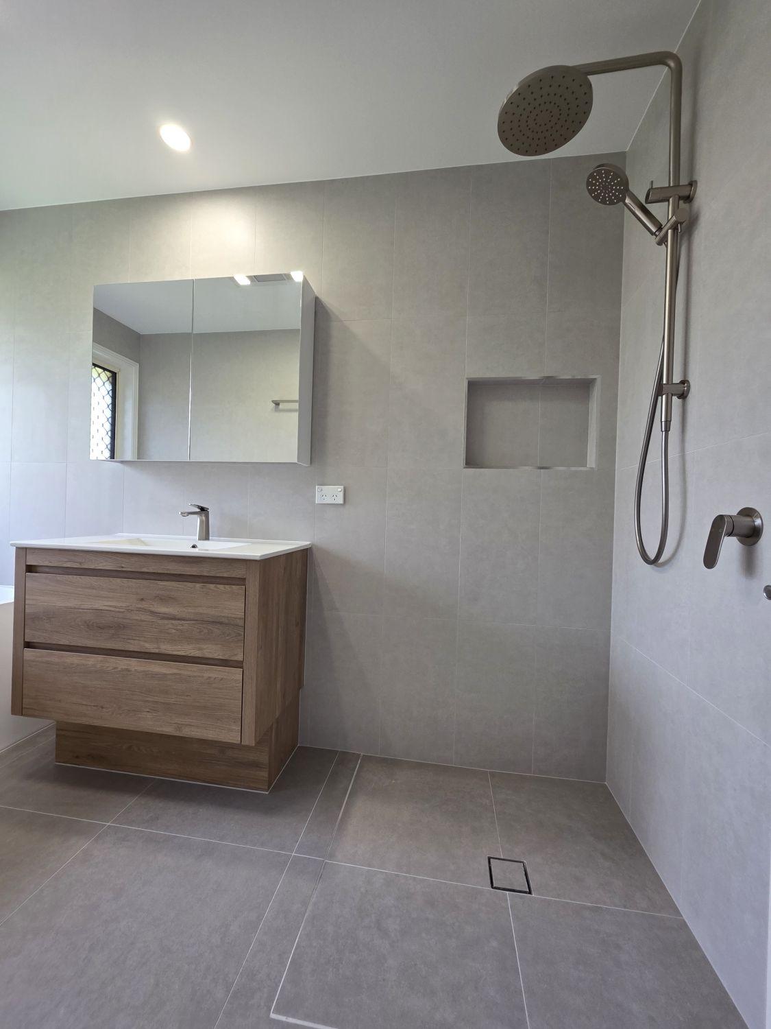 North Lakes main bathroom shower, timber-look vanity and recessed niche