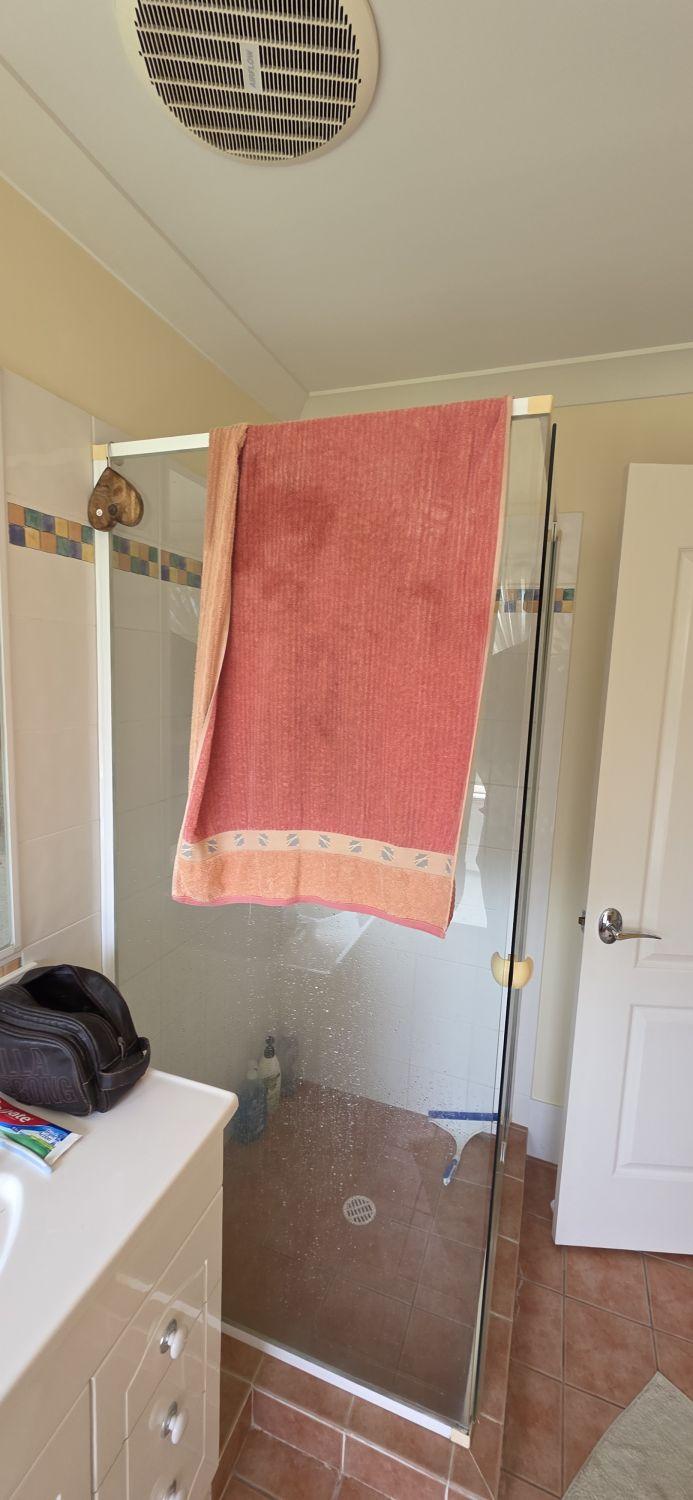 Raised framed shower in the North Lakes main bathroom before renovation