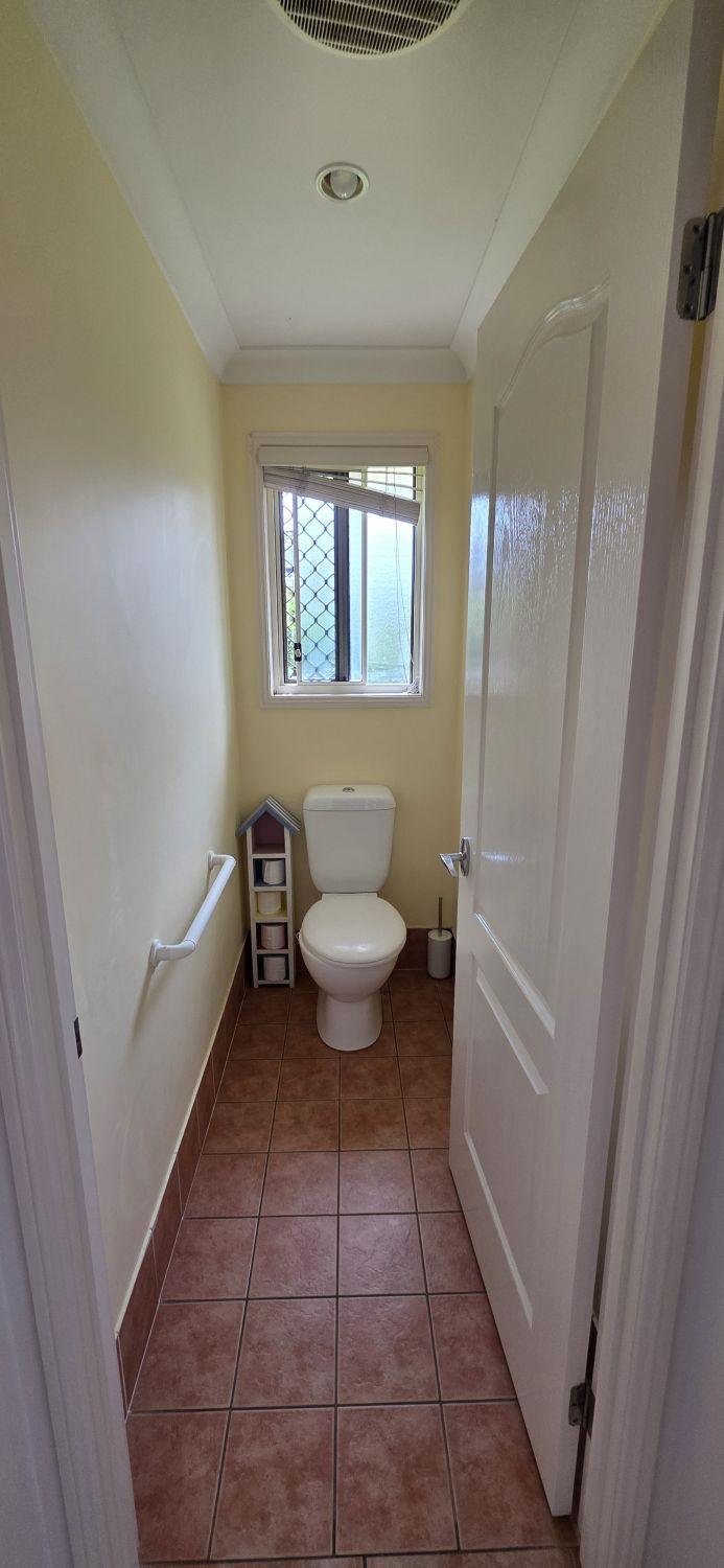 North Lakes separate toilet before renovation with terracotta floor tile