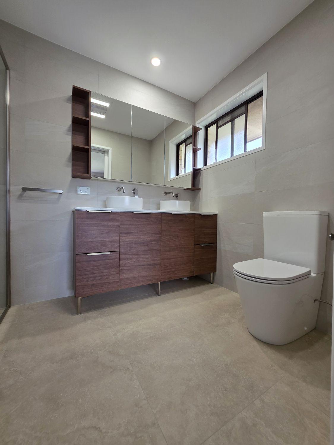 Wishart ensuite after renovation with timber-look double vanity and modern toilet