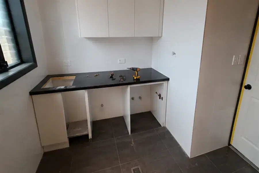 Tile & finish surfaces stage of a laundry renovation in Brisbane