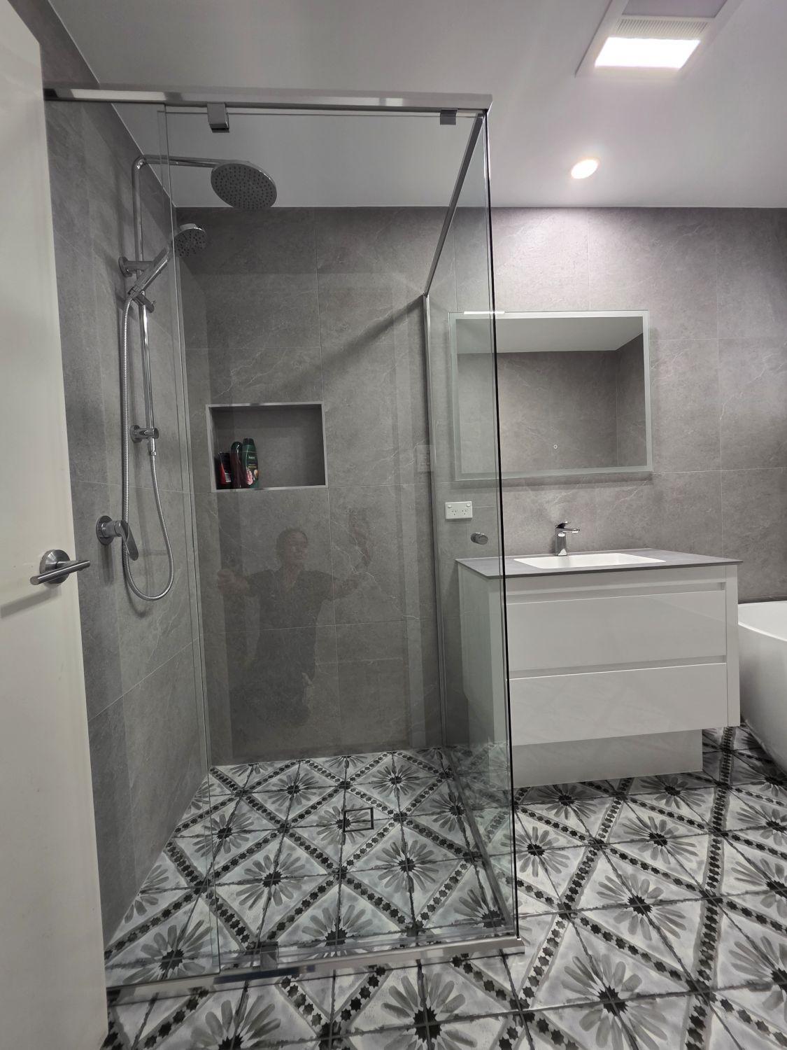 Glass shower and floating white vanity in the Augustine Heights bathroom