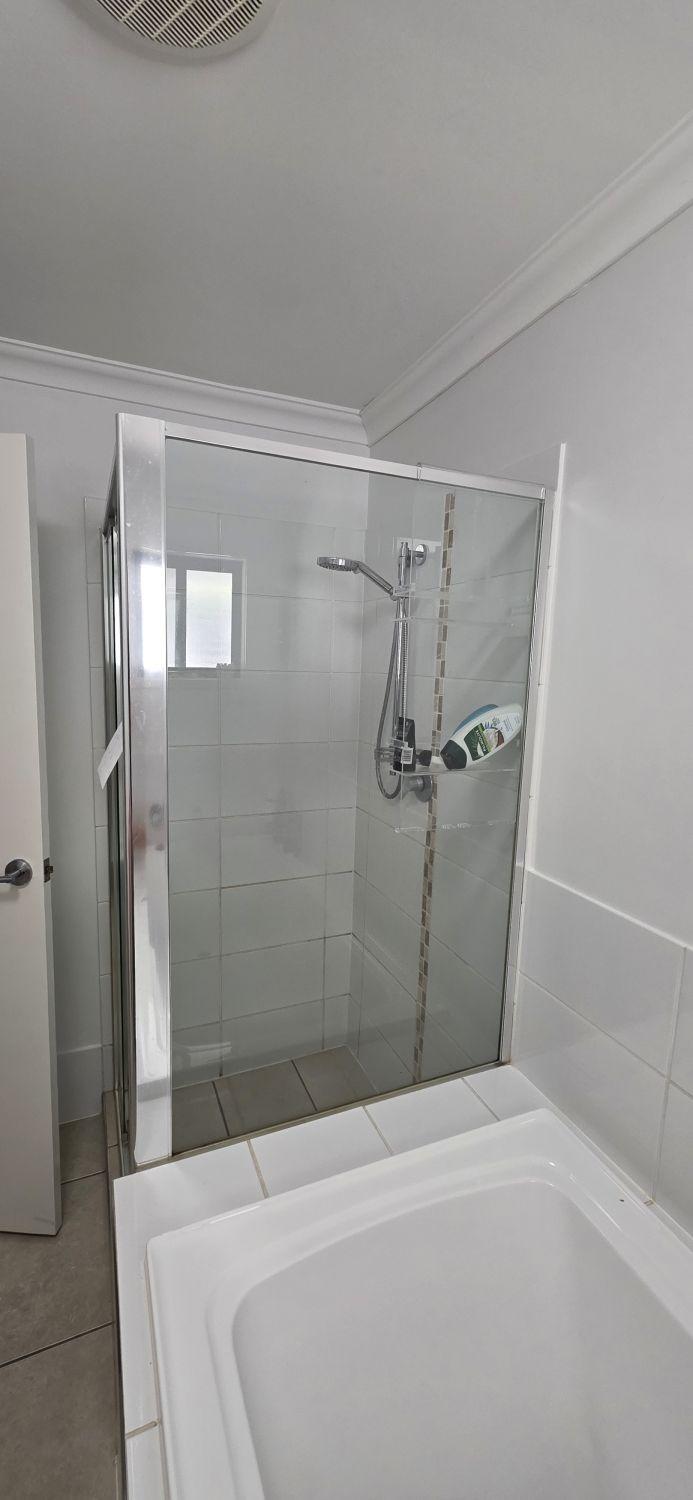 Framed shower in the Augustine Heights bathroom before renovation