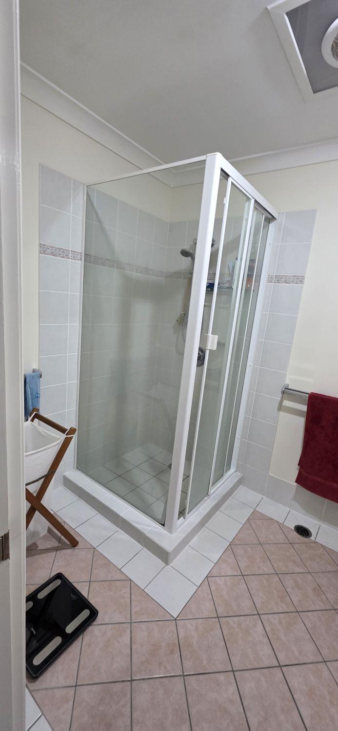 Raised framed shower in the Bardon bathroom before renovation