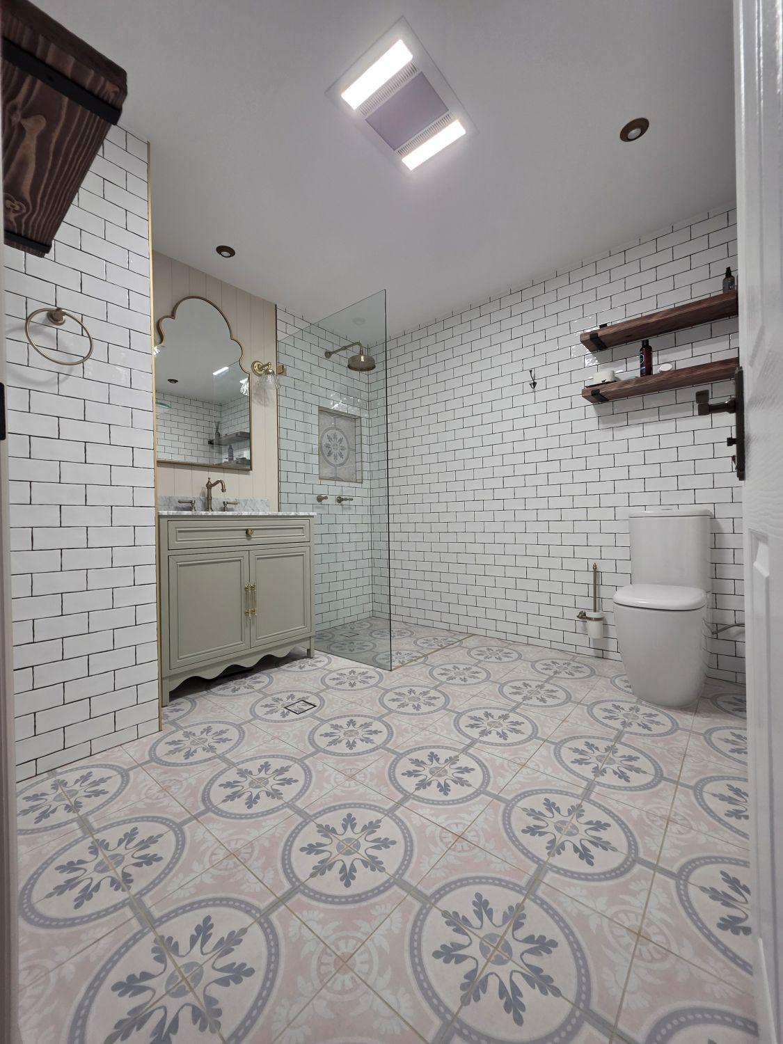 Holland Park bathroom after renovation with open floor, walk-in shower and toilet