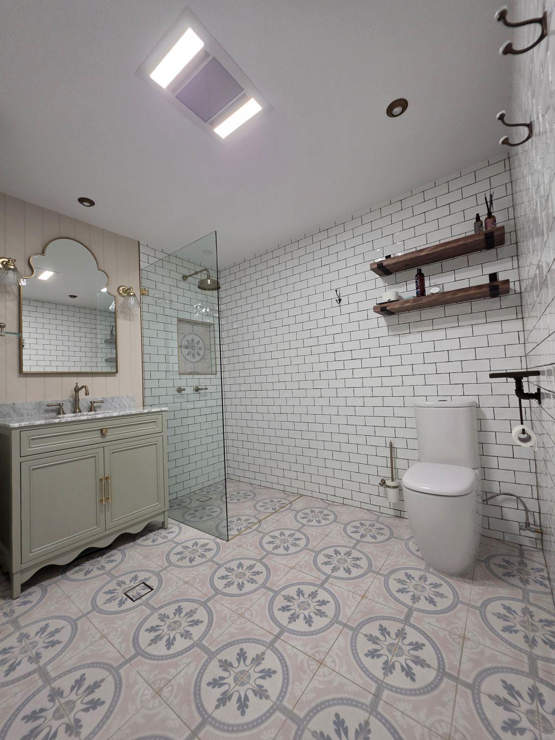 Wide view of the Holland Park bathroom with vanity, shower and toilet