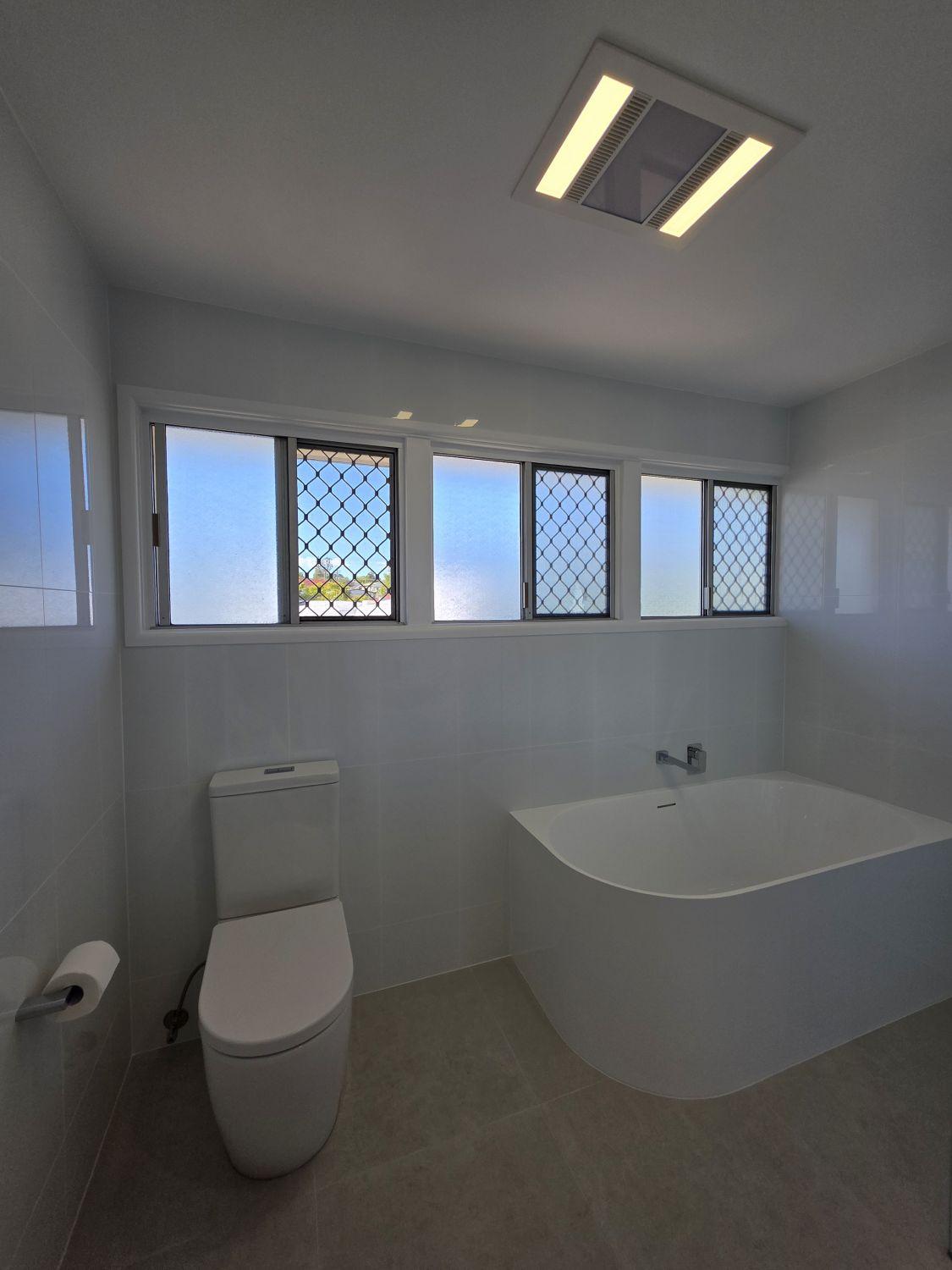 Updated Inala bath and toilet below the window