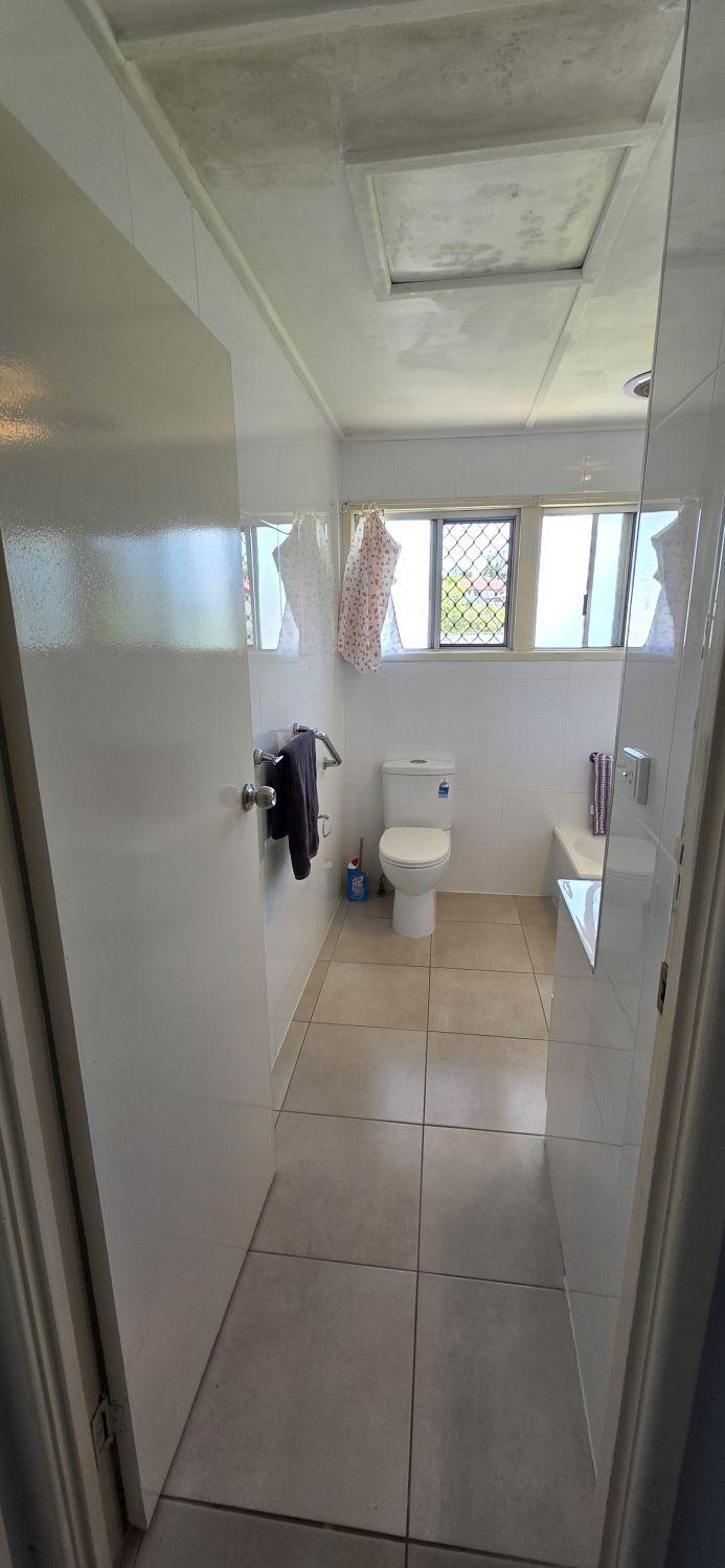 Inala bathroom before renovation viewed from the entrance