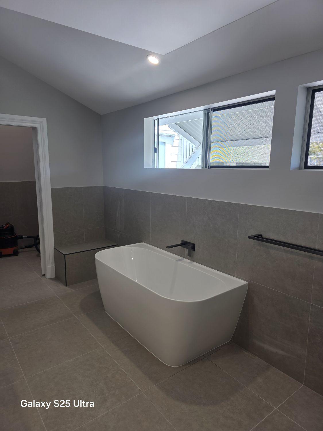 Freestanding bath below the windows in the Kalinga ensuite