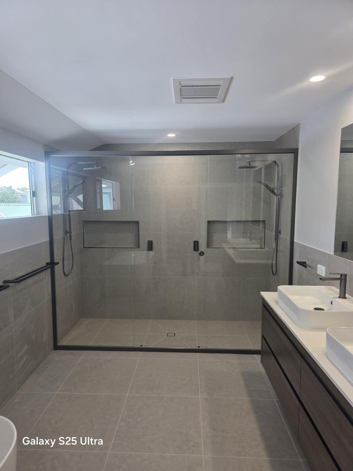 Oversized double shower with two shower stations in the completed Kalinga ensuite