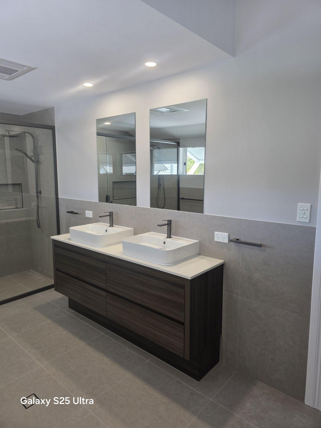 Floating timber-look double vanity with twin countertop basins in Kalinga