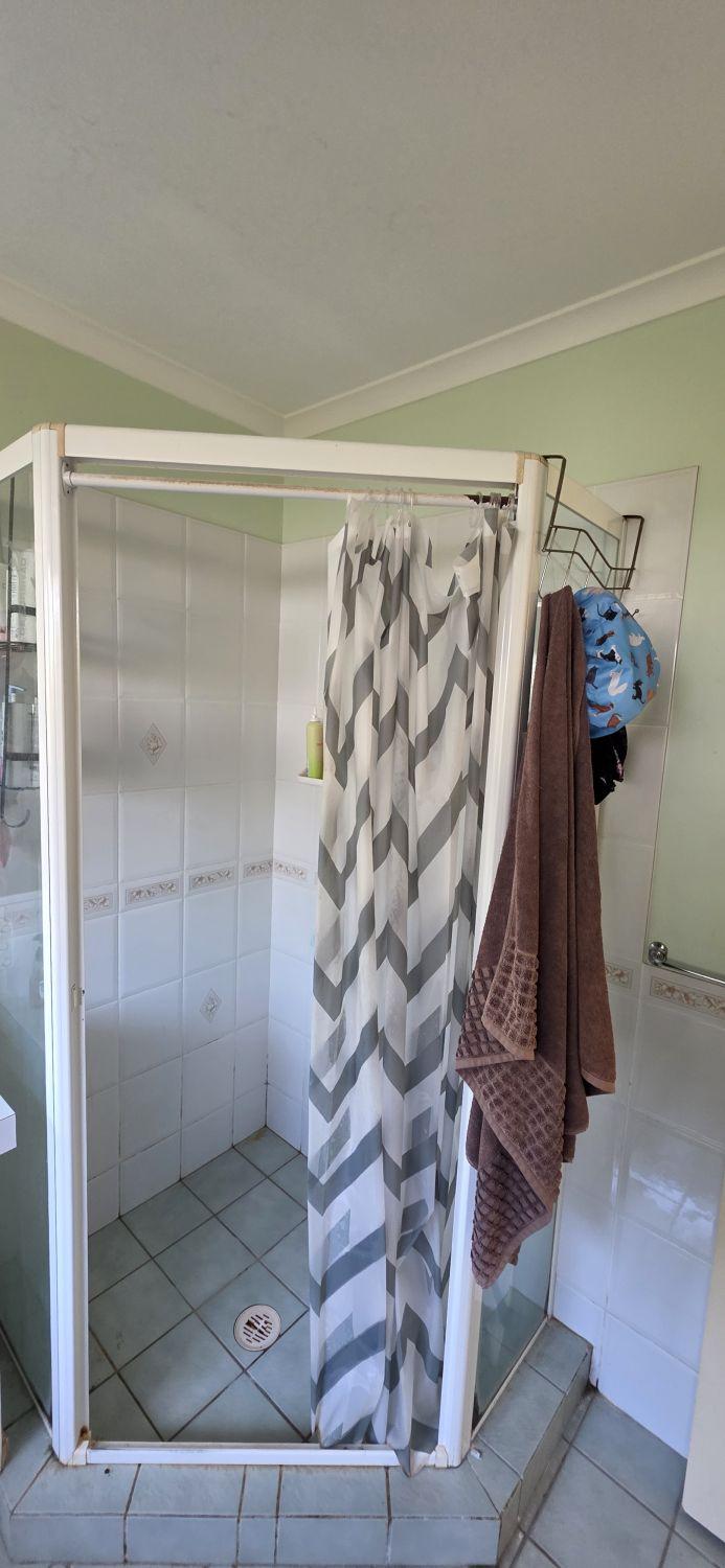 Raised framed shower in the second Karana Downs bathroom before renovation