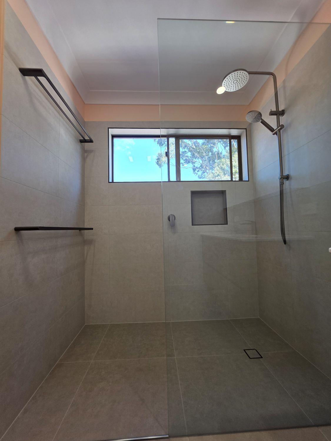 Open shower below the window in the completed Tarragindi bathroom
