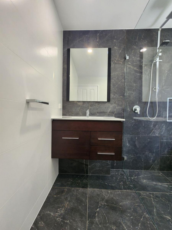 Stylishly renovated bathroom in Brisbane’s Carseldine suburb showcasing contemporary design, elegant fixtures, and bright, spacious interiors