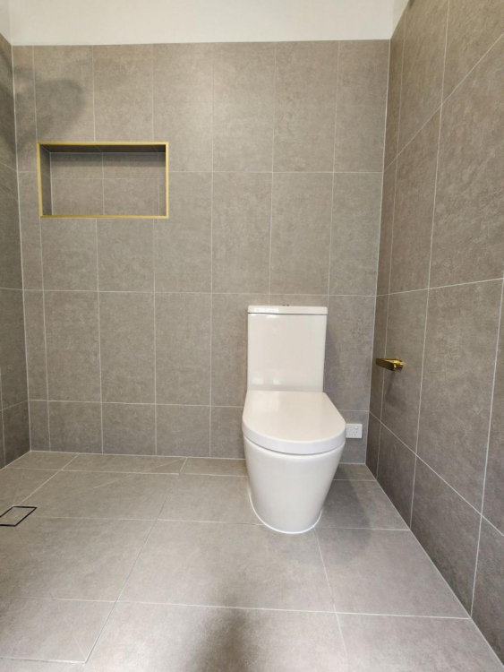 Beautifully renovated bathroom in Brisbane’s Bardon suburb featuring modern fixtures, sleek tiling, and a spacious layout.